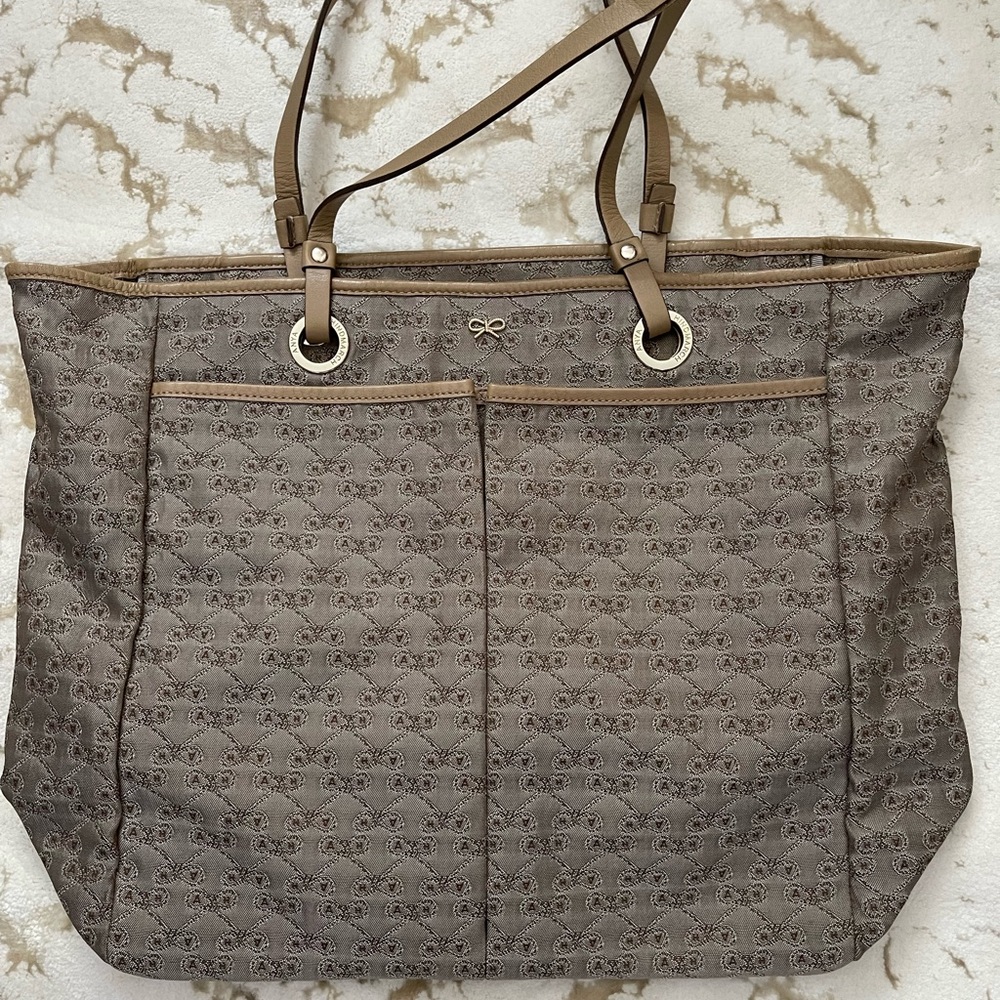 Anya Hindmarch Beige Tote Bag with gold hardware.